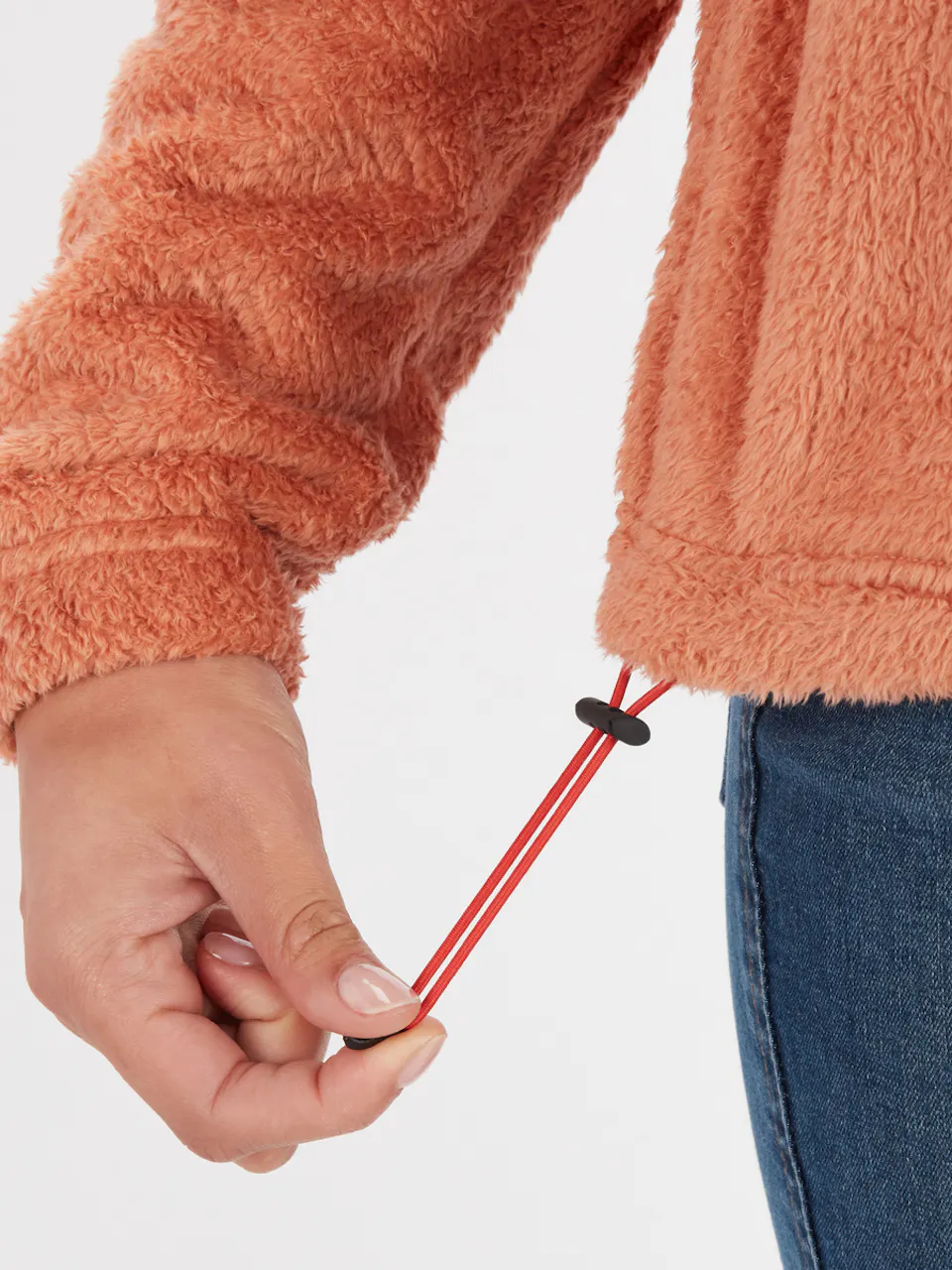 hand demonstrating drawstring on clothing