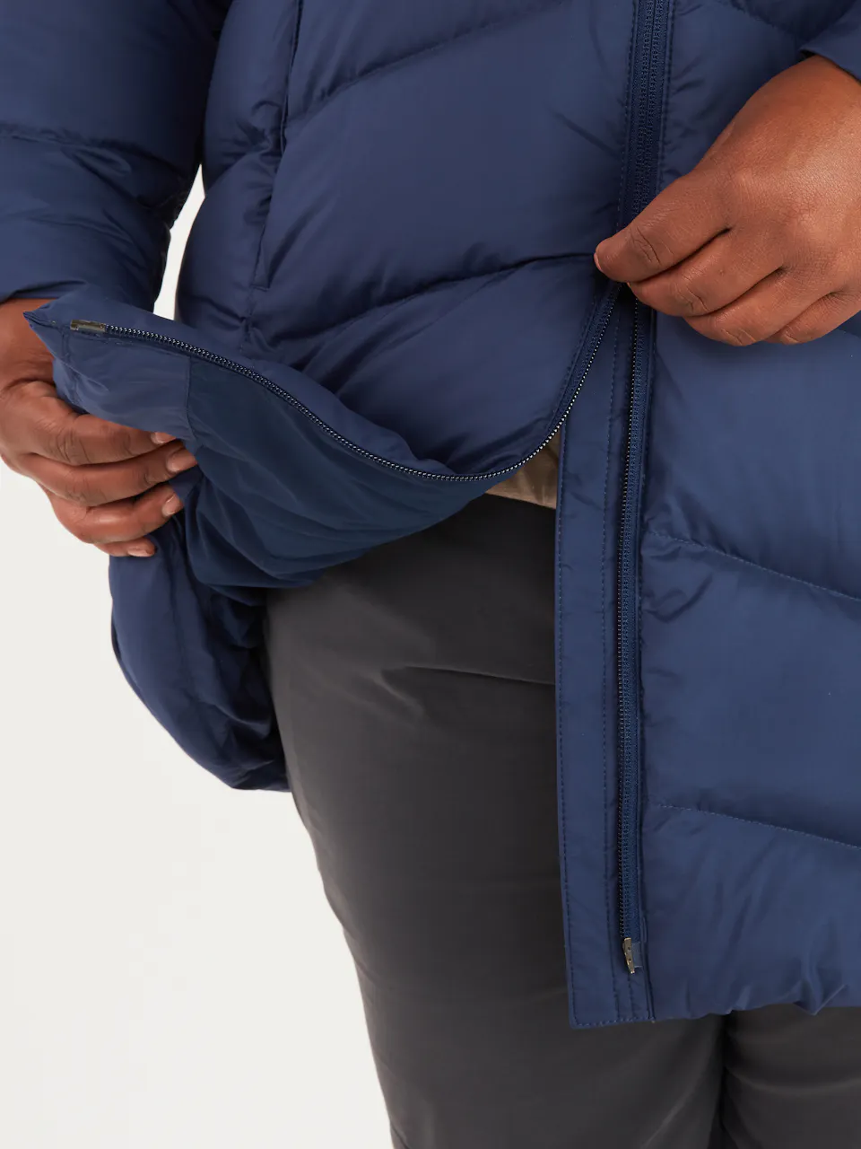 zip at bottom of blue puffer jacket