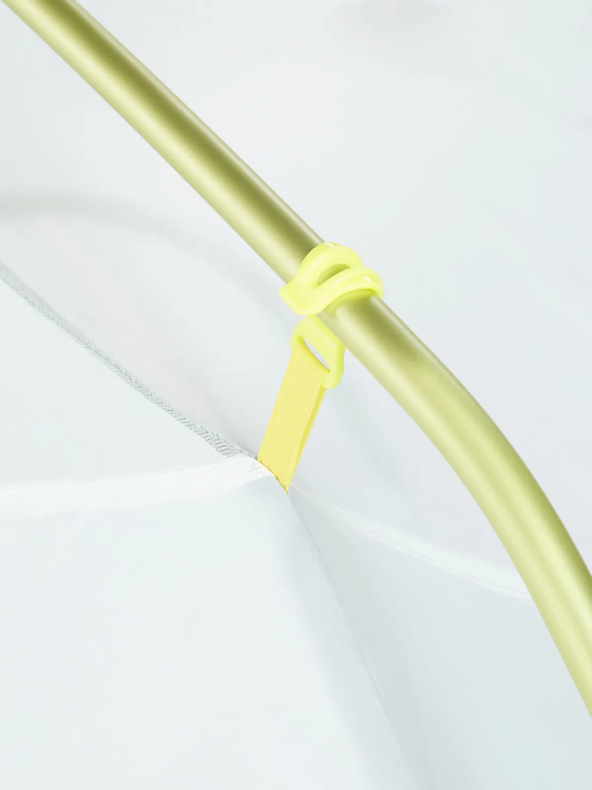 close up of tent hook around pole