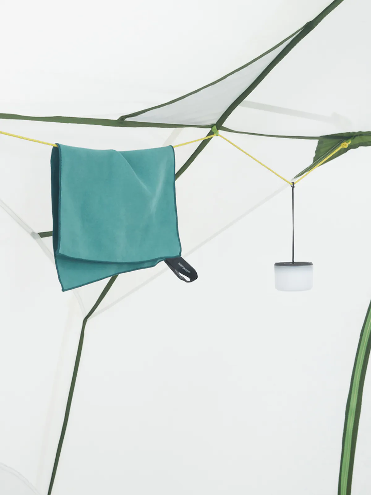 towel hanging on tether inside tent